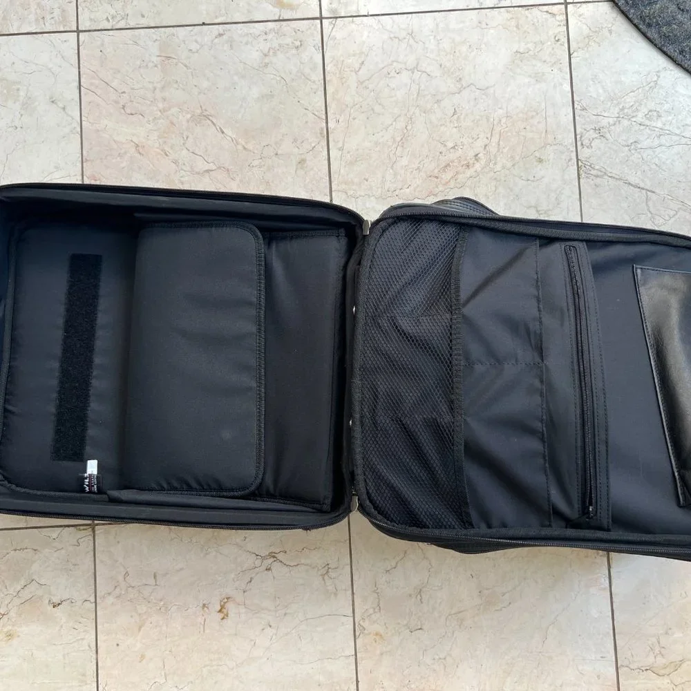 Wilson’s Black Leather Carry on Luggage.